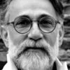 grayscale portrait of a bearded man