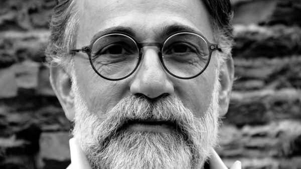 grayscale portrait of a bearded man