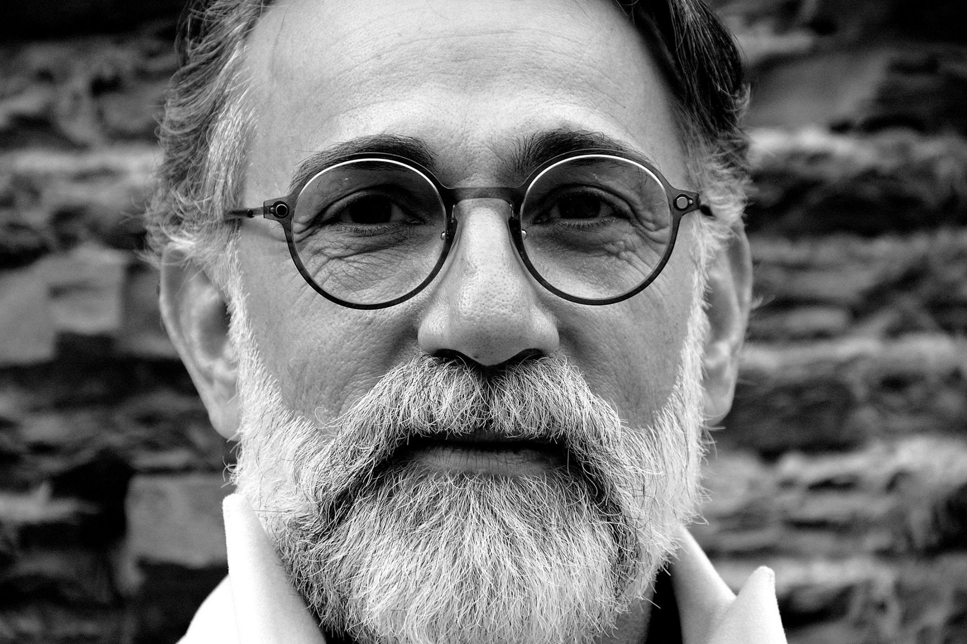 grayscale portrait of a bearded man