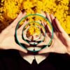 photo of woman holding a mirror