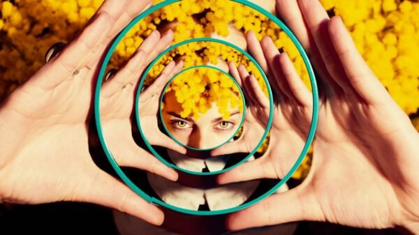 photo of woman holding a mirror