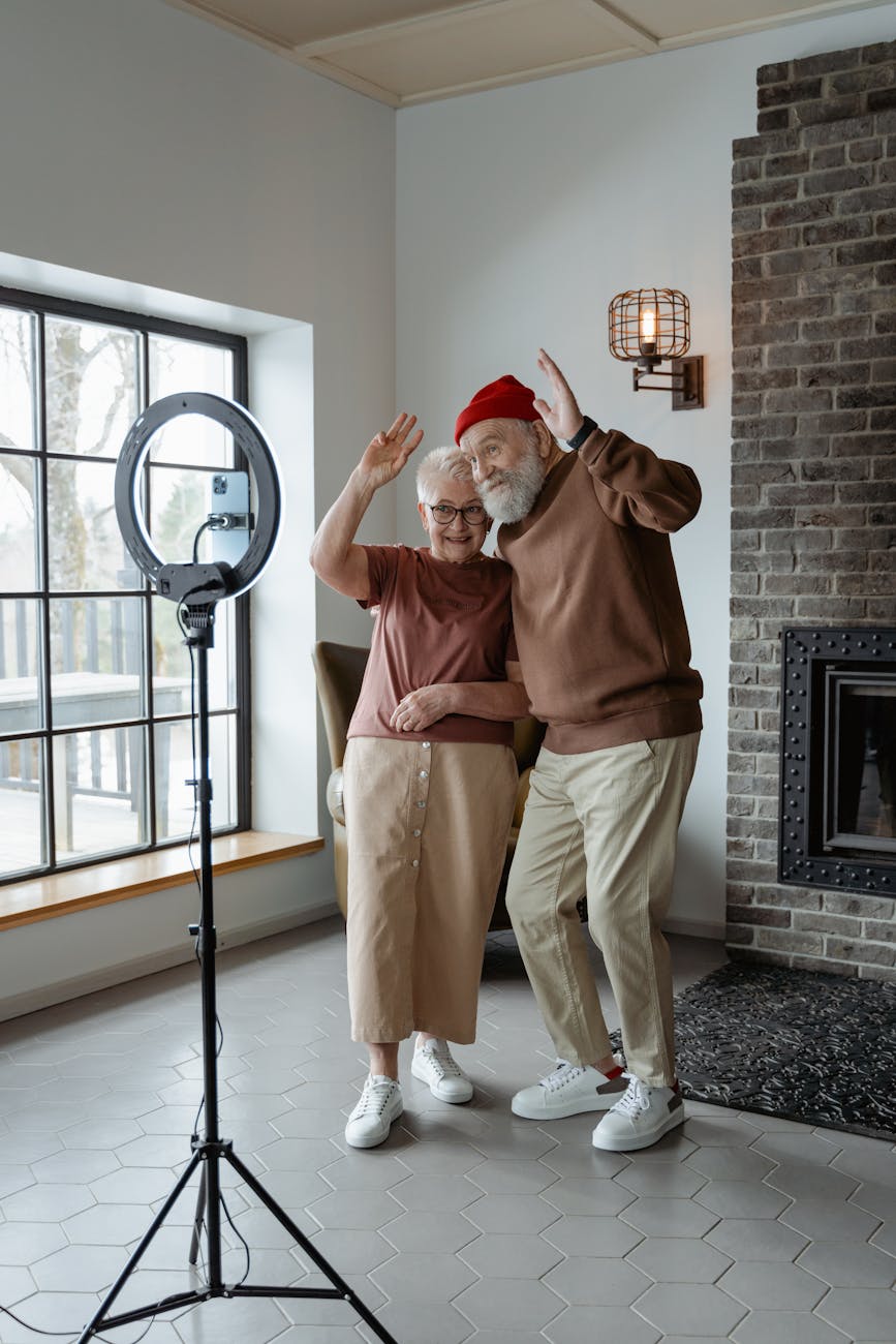 man and woman standing in front of a mobile phone