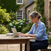 Woman working remotely on a laptop in a garden, representing freelancers who benefit from legal backup.