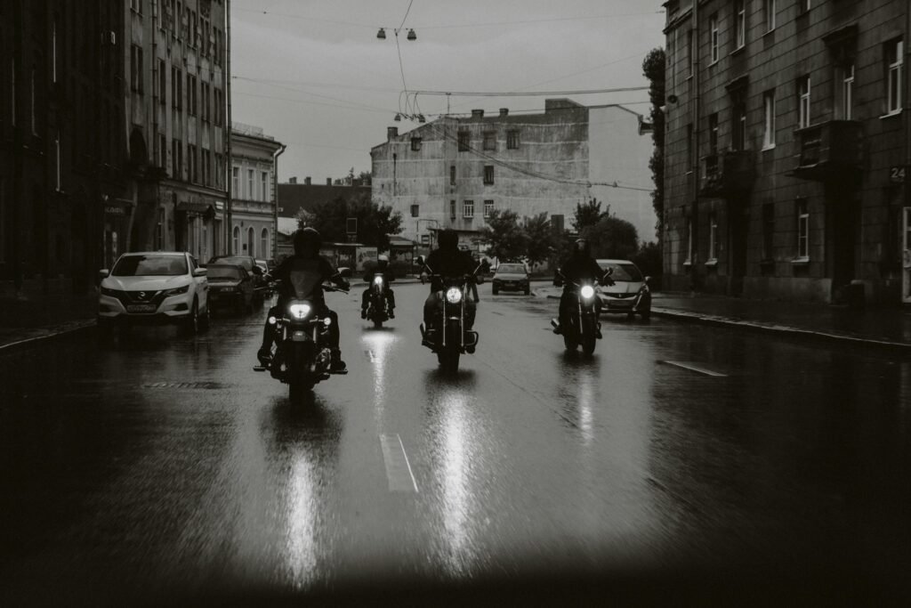 Motorcyclists riding through a city street, representing freedom and touring later in life