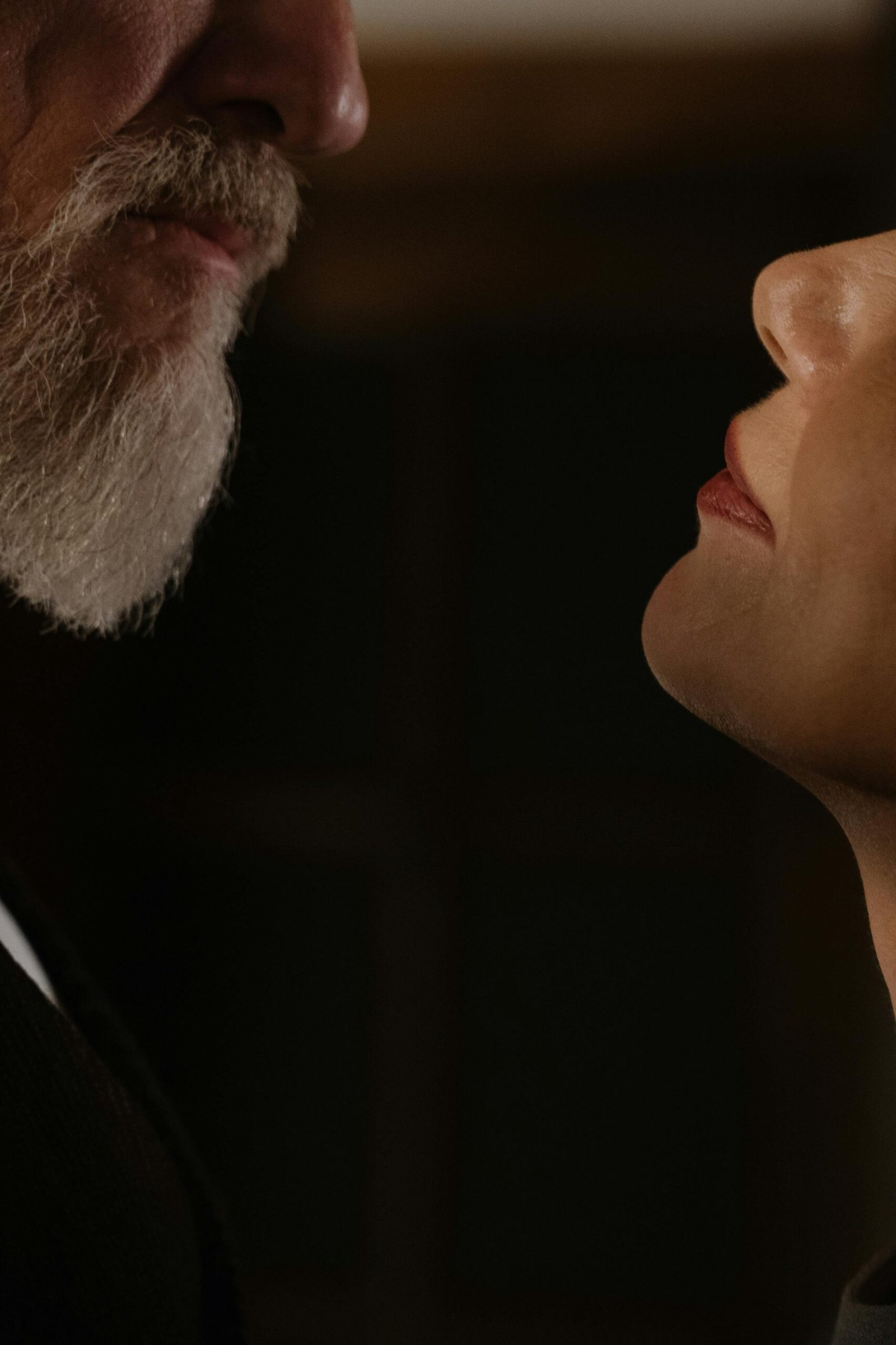 Close-up of an older couple facing each other, highlighting intimacy and trust