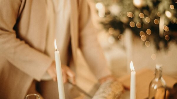Older woman preparing a cozy candlelit meal at home, embracing simple traditions and a slower pace of life