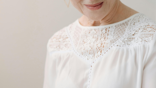 Woman in her 60s reading a book quietly, reflecting during a calm midlife moment