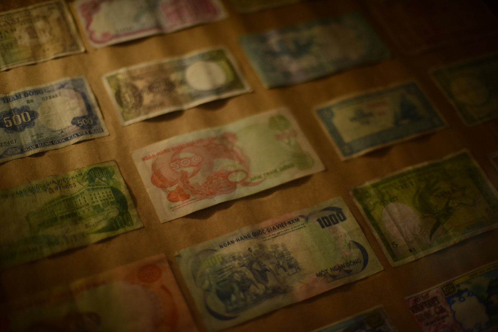 Collection of international paper currency displayed together, representing financial value, history, and emotional meaning attached to money