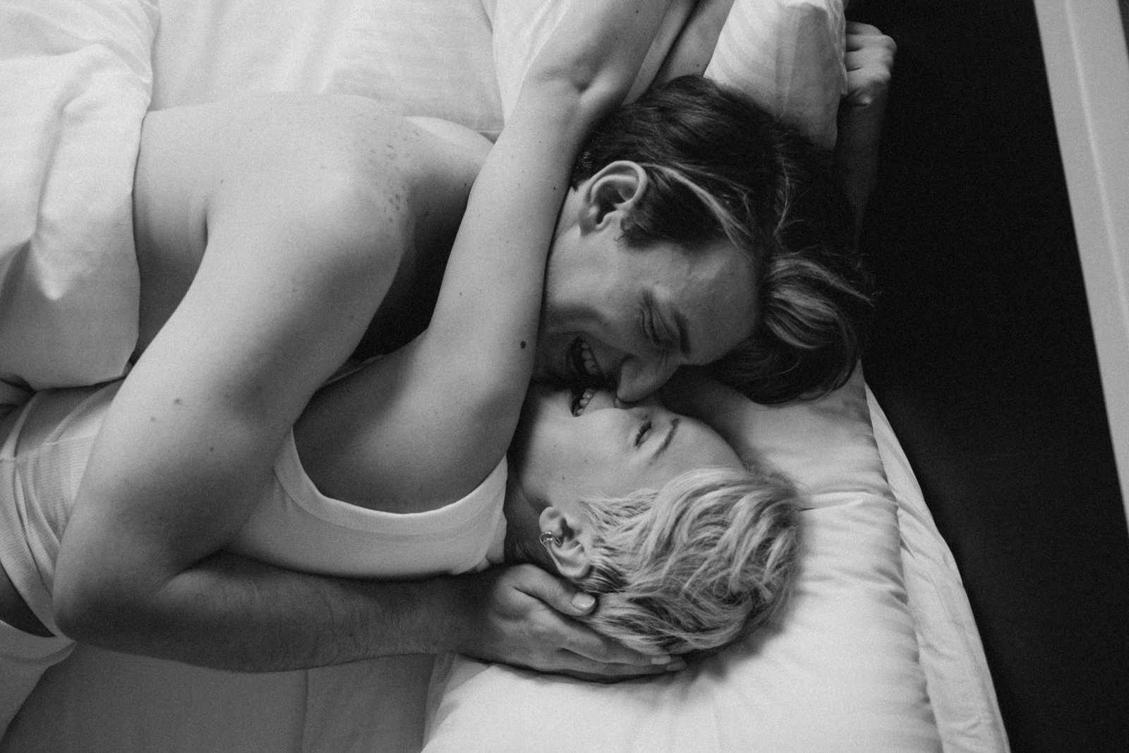 Pressure-free intimacy between a couple sharing a relaxed, affectionate moment in bed