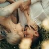Midlife couple experiencing pressure-free intimacy through gentle touch and emotional closeness