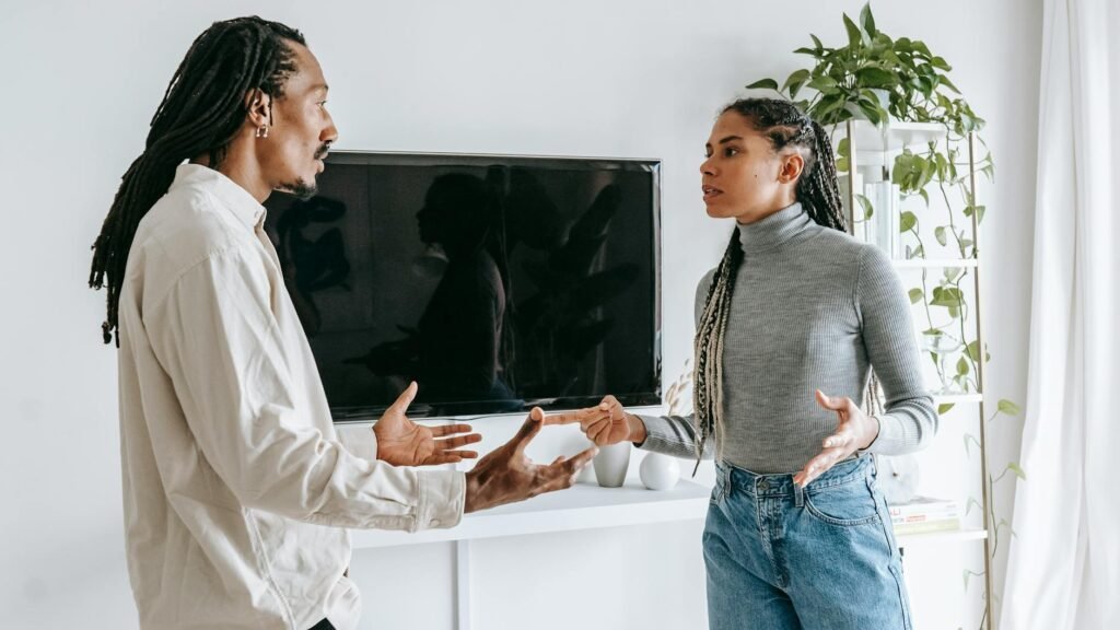 dissatisfied young ethnic couple having argument at home