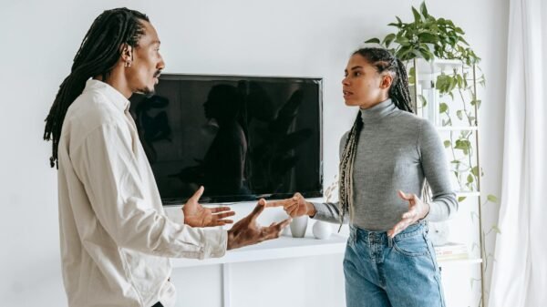 dissatisfied young ethnic couple having argument at home