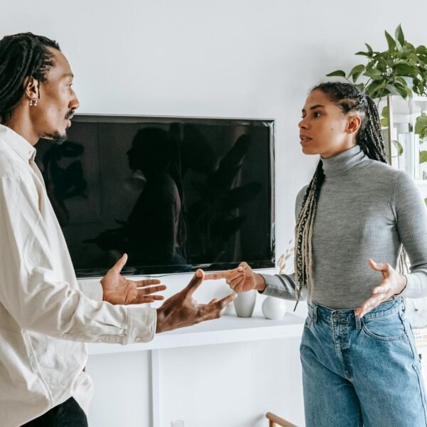 dissatisfied young ethnic couple having argument at home